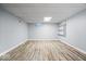 Finished basement with wood-look flooring and recessed lighting, creating a cozy space at 567 Hawthorne Dr, Carmel, IN 46033