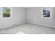 Bedroom featuring neutral carpet, two sunny windows, and light gray paint at 567 Hawthorne Dr, Carmel, IN 46033