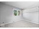 Bedroom with neutral carpet, window overlooking outside view, and overhead lighting at 567 Hawthorne Dr, Carmel, IN 46033