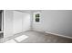 Bedroom with closet, bright window, and neutral carpet at 567 Hawthorne Dr, Carmel, IN 46033