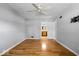 Comfortable bedroom with hardwood floors and ceiling fan, and an ensuite bathroom at 567 Hawthorne Dr, Carmel, IN 46033