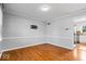 Bright dining room with hardwood floors, neutral paint, and access to the kitchen at 567 Hawthorne Dr, Carmel, IN 46033