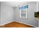 Dining Room features hardwood floors, chandelier and a window with blinds at 567 Hawthorne Dr, Carmel, IN 46033