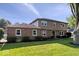 Beautiful two-story home with brick and siding, landscaped yard, and mature trees on a sunny day at 567 Hawthorne Dr, Carmel, IN 46033