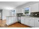 Bright kitchen features stainless appliances, light countertops, and ample cabinet storage at 567 Hawthorne Dr, Carmel, IN 46033
