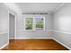 Bright living room featuring beautiful trim work, and natural light from the window at 567 Hawthorne Dr, Carmel, IN 46033