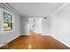 Bright living room with hardwood floors, neutral walls, and a large window at 567 Hawthorne Dr, Carmel, IN 46033