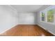 Bright living room featuring hardwood floors and natural light from the window at 567 Hawthorne Dr, Carmel, IN 46033