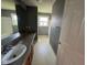 Bathroom with a long vanity, large mirror, neutral gray walls, and ample counter space at 5683 James Blair Dr, Indianapolis, IN 46234