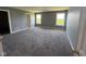 This bedroom offers new carpet, neutral walls, and two windows that provide great natural light at 5683 James Blair Dr, Indianapolis, IN 46234