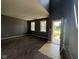 Bright entryway features an open door, neutral gray walls, and leads into a carpeted living space at 5683 James Blair Dr, Indianapolis, IN 46234