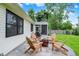 Outdoor space featuring adirondack chairs and fire pit, with a screened-in porch offering a relaxing ambiance at 572 Quail Ridge Dr, Westfield, IN 46074