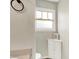 Neutral bathroom with white storage cabinet and an 