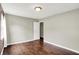 Bright bedroom with hardwood floors, closet, and neutral walls, creating a calm and inviting atmosphere at 572 Quail Ridge Dr, Westfield, IN 46074