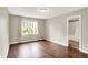 Charming bedroom with hardwood floors, natural light from the window, and ensuite bathroom access at 572 Quail Ridge Dr, Westfield, IN 46074