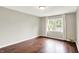 Bright bedroom featuring hardwood floors, neutral walls, and a window with natural light at 572 Quail Ridge Dr, Westfield, IN 46074