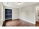 Neutral bedroom featuring hardwood floors, a closet, and natural light at 572 Quail Ridge Dr, Westfield, IN 46074