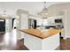 Modern kitchen with stainless appliances, wood island, and an open floor plan at 572 Quail Ridge Dr, Westfield, IN 46074