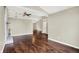 Spacious living room featuring a brick fireplace, ceiling fan, and hardwood floors at 572 Quail Ridge Dr, Westfield, IN 46074
