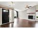 Spacious living room featuring wood floors, a brick fireplace, and lots of natural light at 572 Quail Ridge Dr, Westfield, IN 46074