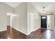 Open living space with dark hardwood floors, neutral paint and white trim at 572 Quail Ridge Dr, Westfield, IN 46074