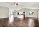 Expansive living room with kitchen view, hardwood floors, and lots of light at 572 Quail Ridge Dr, Westfield, IN 46074