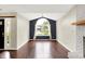 Bright living room featuring wood floors, vaulted ceilings, and a large arched window at 572 Quail Ridge Dr, Westfield, IN 46074