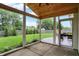Screened-in patio with a beautiful wood ceiling and a view of the backyard at 572 Quail Ridge Dr, Westfield, IN 46074