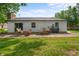 Patio with outdoor seating, grill, and a view of the house and backyard at 5811 Simmul Cir, Indianapolis, IN 46221