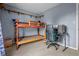 Bedroom featuring a bunk bed, desk, gray walls, and neutral-toned carpeting at 5811 Simmul Cir, Indianapolis, IN 46221