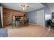 Cozy dining area featuring a wood table, chairs, brick fireplace, and stylish decor at 5811 Simmul Cir, Indianapolis, IN 46221