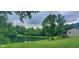 A stunning pond view framed by mature trees and lush greenery enhances this home's appeal at 600 Old Moore Rd, Martinsville, IN 46151