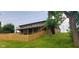 Backyard featuring a split level deck and fenced-in yard, surrounded by greenery at 600 Old Moore Rd, Martinsville, IN 46151