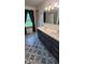 Bathroom featuring a double vanity, decorative flooring, and a shower/tub combo at 600 Old Moore Rd, Martinsville, IN 46151