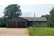 Single-story home with a brick accented two-car garage and manicured lawn at 600 Old Moore Rd, Martinsville, IN 46151