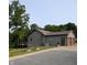 Exterior of a home with a two-car garage, featuring a paved driveway and mature landscaping at 600 Old Moore Rd, Martinsville, IN 46151