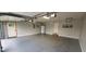 A spacious garage with epoxy flooring and two entry doors at 600 Old Moore Rd, Martinsville, IN 46151