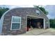 Interior view of a large garage area with ample space, storage, and a clean, organized appearance at 600 Old Moore Rd, Martinsville, IN 46151