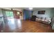 Spacious living room featuring hardwood floors, large windows and comfortable seating at 600 Old Moore Rd, Martinsville, IN 46151