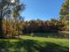 Scenic view of a pond reflecting the changing fall foliage on a sunny day at 600 Old Moore Rd, Martinsville, IN 46151