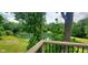 Glimpse of the tranquil pond framed by lush greenery, viewed from the deck at 600 Old Moore Rd, Martinsville, IN 46151