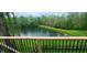An elevated view of the pond from the deck showcases the lush landscaping and serene setting at 600 Old Moore Rd, Martinsville, IN 46151