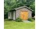 Charming shed exterior with stone facade and double wooden doors at 600 Old Moore Rd, Martinsville, IN 46151
