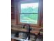 Close up of granite counters paired with a dual basin sink overlooking the backyard at 600 Old Moore Rd, Martinsville, IN 46151