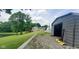 A beautiful yard with a pond, home, and outbuilding, showcasing the property's spaciousness at 600 Old Moore Rd, Martinsville, IN 46151