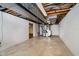 Unfinished basement with exposed pipes, a concrete floor, and a water heater at 6146 Rucker Rd, Indianapolis, IN 46220