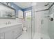 Bright and modern bathroom features a walk-in shower and vanity at 6146 Rucker Rd, Indianapolis, IN 46220