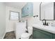 The bathroom has a washing machine and dryer and a blue vanity at 6146 Rucker Rd, Indianapolis, IN 46220
