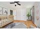 Bright Bedroom with wooden floors, natural light, and neutral decor at 6146 Rucker Rd, Indianapolis, IN 46220