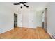 An empty bedroom has a window with curtains and hardwood floors at 6146 Rucker Rd, Indianapolis, IN 46220